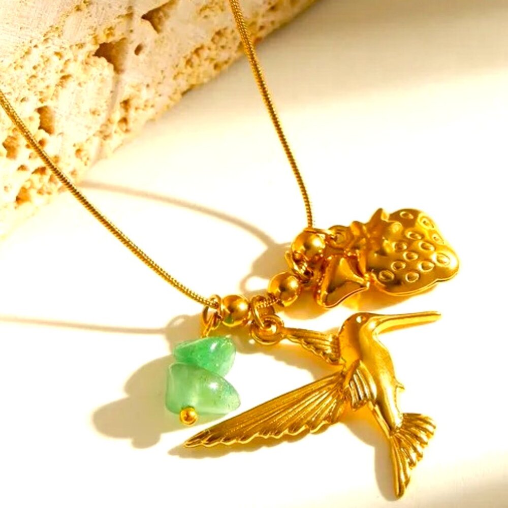 18K GOLD DIP CHARM NECKLACE FALCON GREEN STONE AND GOLD STRAWBERRY CHARM